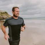 Shane Williams running along the beach.
