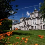 Cardiff University's main building as shown from the outside on a bright sunny day