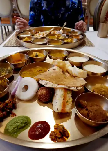Indian food on a round plate