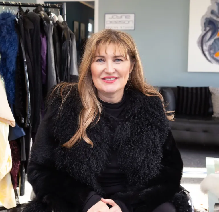 Fashion designer Jayne Pierson sitting in her fashion studio at Pembrey Airport