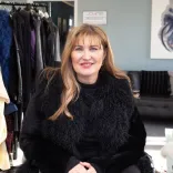 Fashion designer Jayne Pierson sitting in her fashion studio at Pembrey Airport