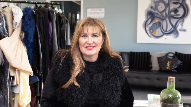 Fashion designer Jayne Pierson sitting in her fashion studio at Pembrey Airport