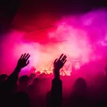 Hands in the air at a concert.