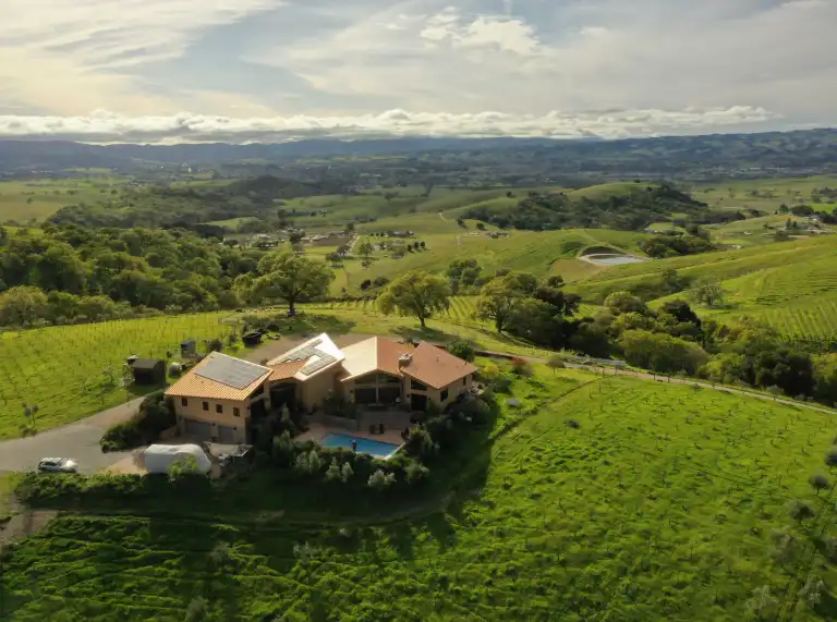 A view of Ambyth Estate surrounded by green fields.
