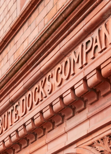 Exterior brickwork of Pierhead building in Cardiff Bay, showing the words 'Bute Docks Company'