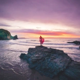 person looking out to sea in Wales