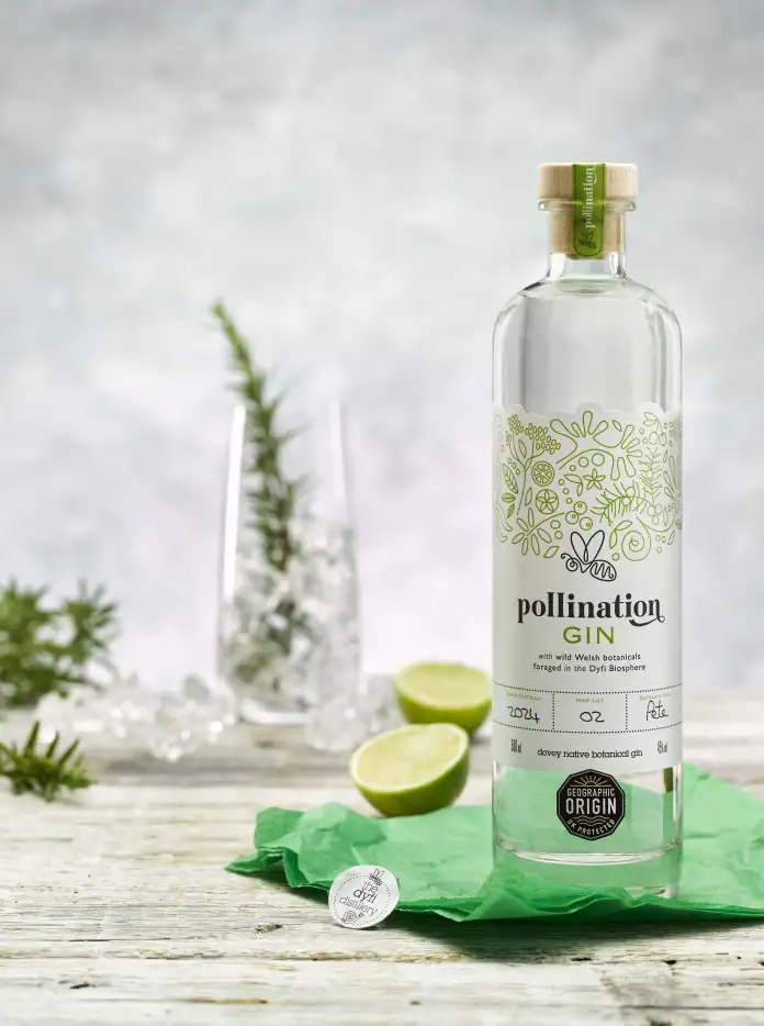 A bottle of gin on a table.