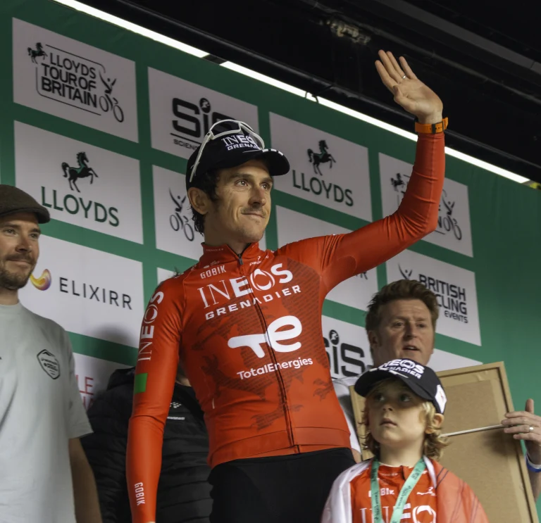 Geraint Thomas waving from a stage