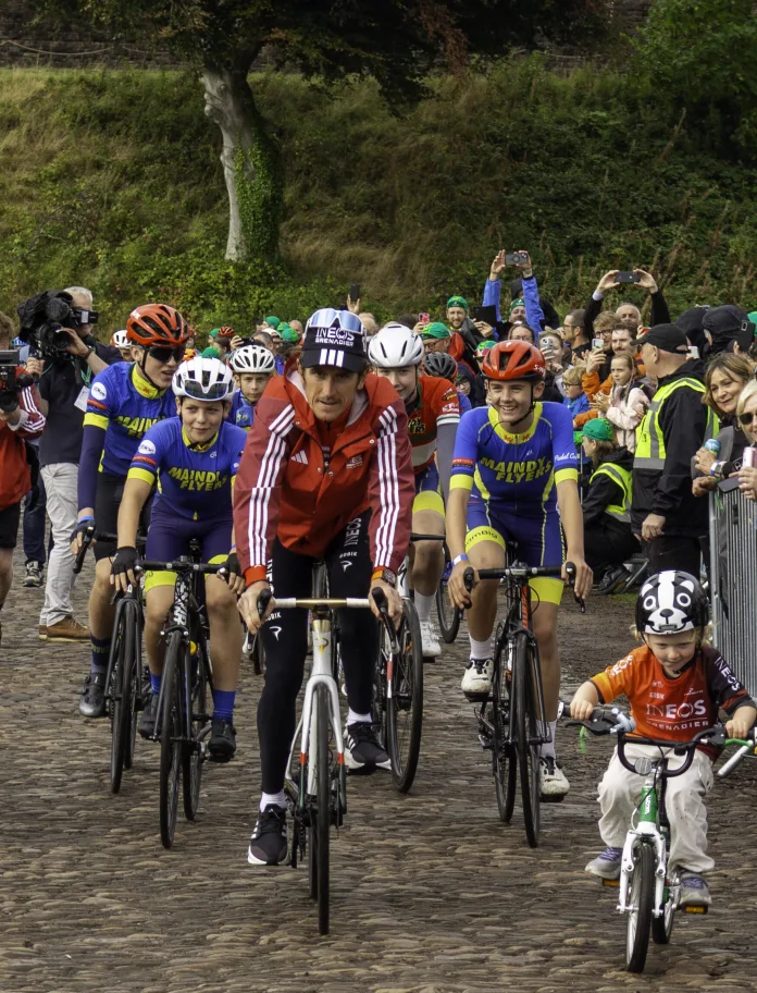 Geraint Thomas and a group of people cycling