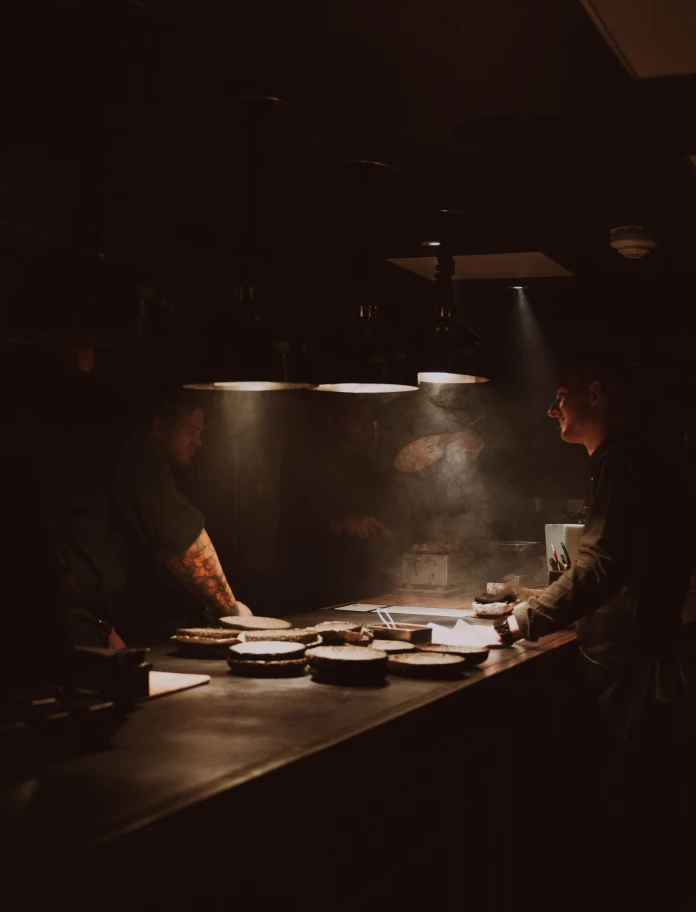 A view of the kitchen and the chefs.