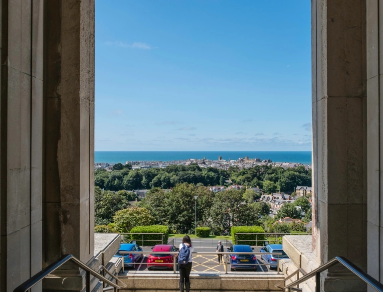 view of sea through museum door.