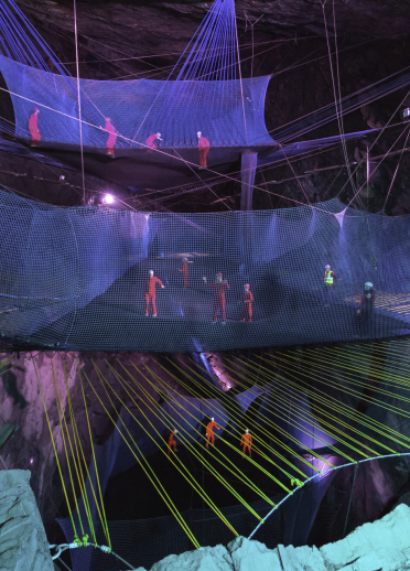 Visitors on the underground trampolines at Bounce Below in Blaenau Ffestiniog, North Wales