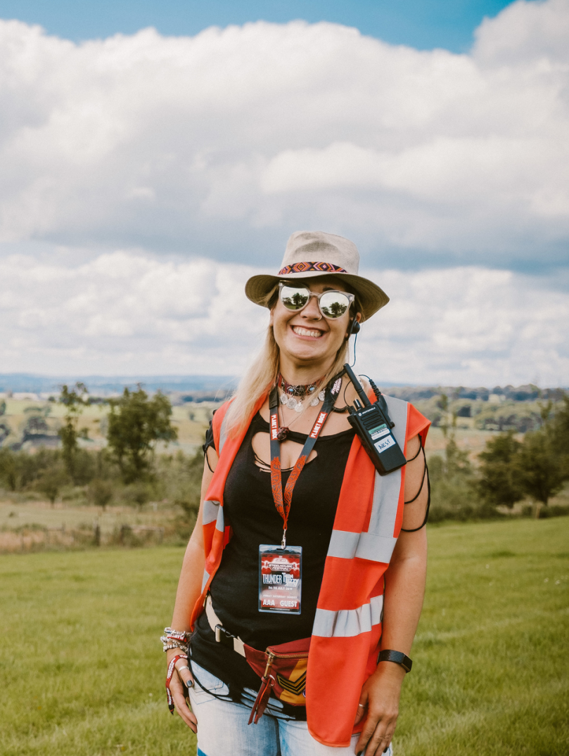 Sarah Price, steward of the Steelhouse Festival with the countryside in the background.