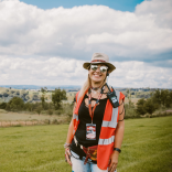 Sarah Price, steward of the Steelhouse Festival with the countryside in the background.