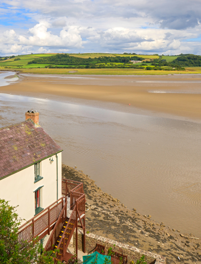 Dylan Thomas Boathouse and Taf estuary, Laugharne, Carmarthenshire