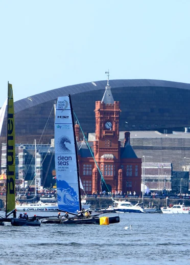 Volvo Ocean Race teams racing in front of Wales Millenium Centre, Cardiff Bay