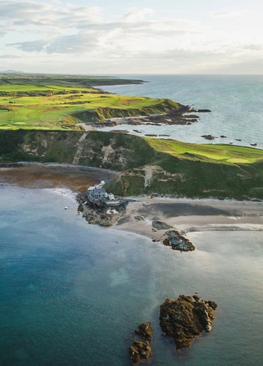 Small village on a green headland in the sea