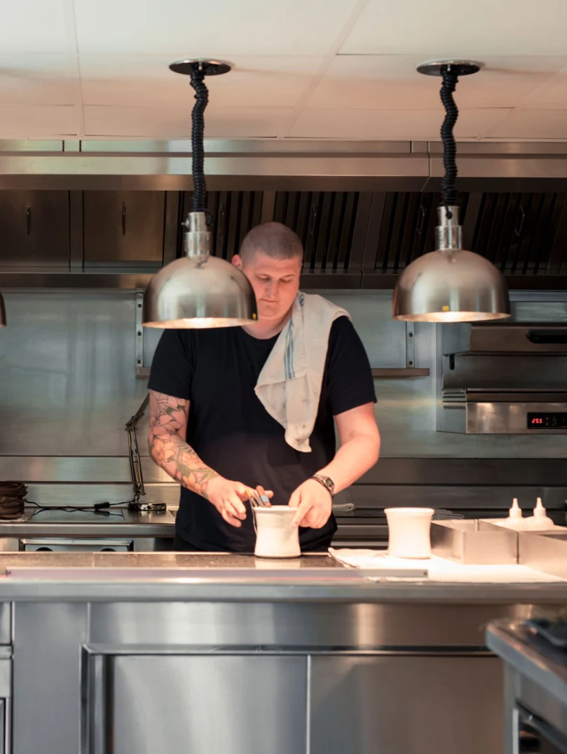 kitchen with man (chef) preparing food