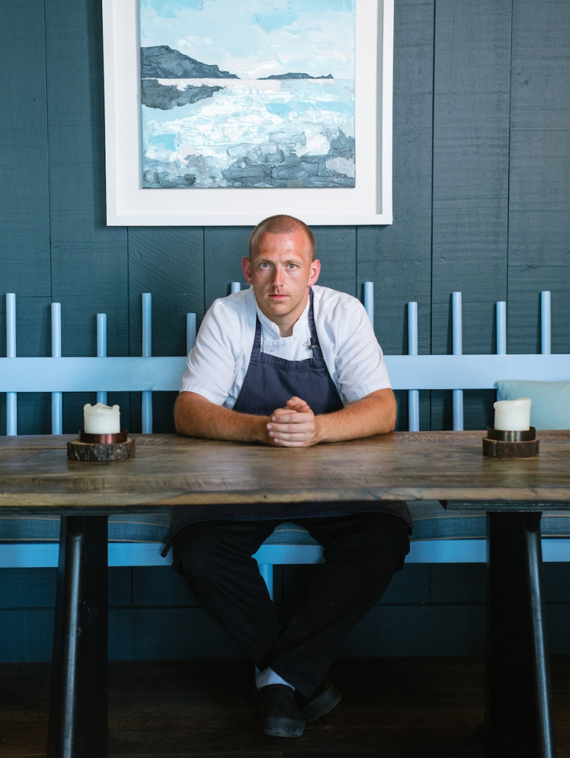 Hywel Griffith sat at a table in his restaurant Beach House.