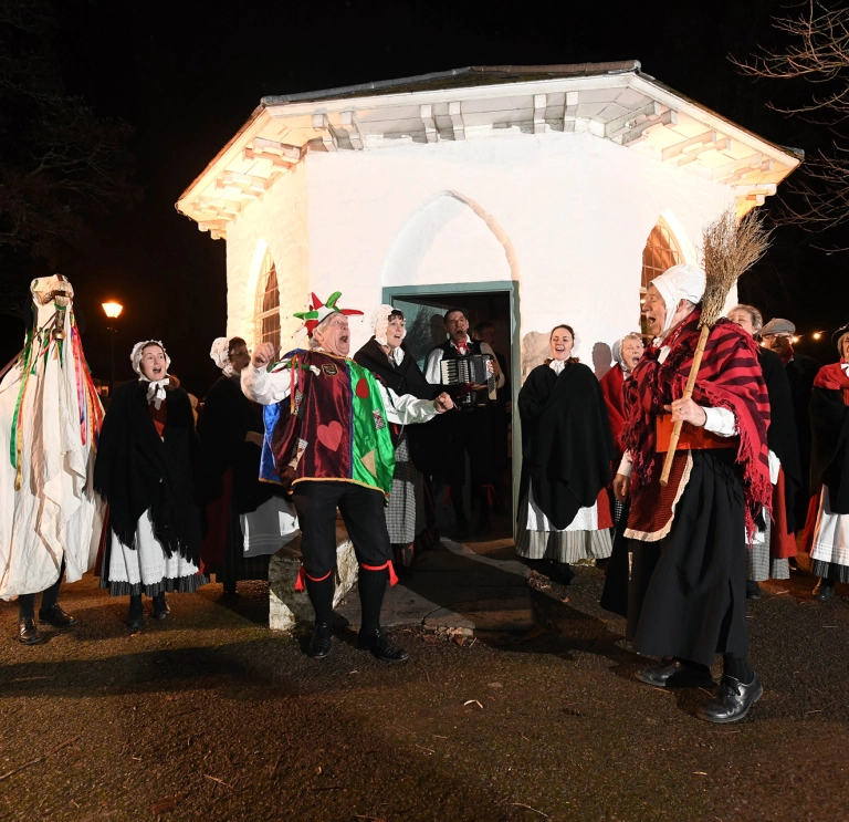 A Mari Lwyd and dancers.